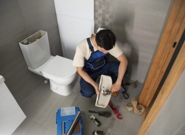 male-plumber-working-fix-problems-client-s-house