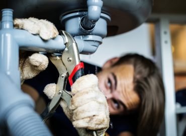 Man fixing kitchen sink